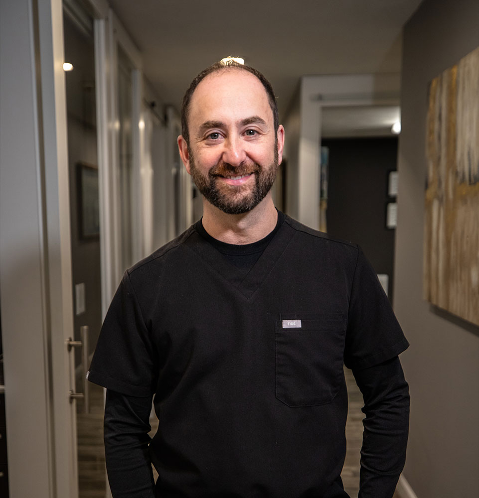 headshot of doctor inside of the dental center